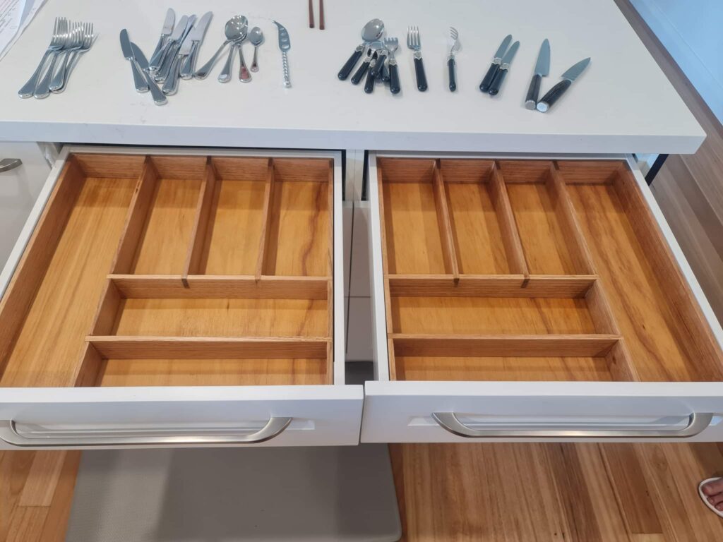 Two empty cutlery dividers