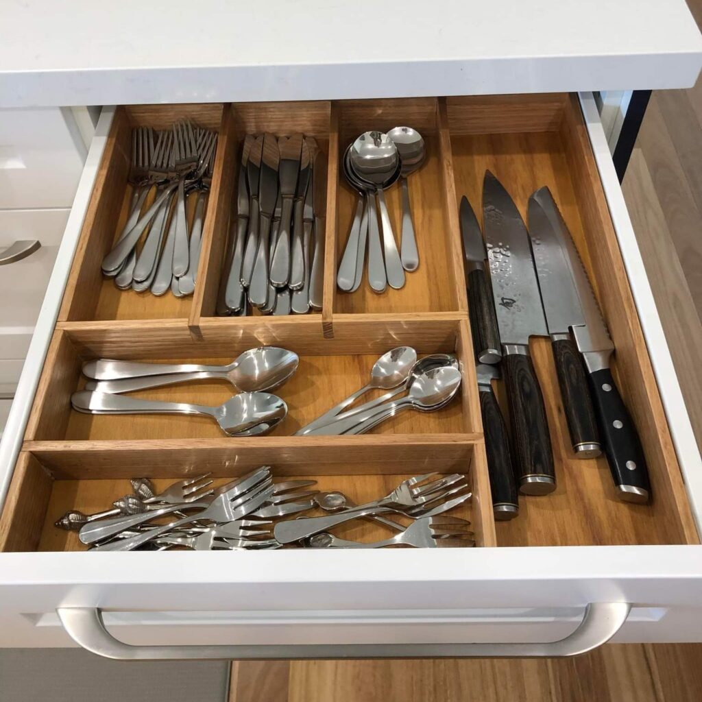 Cutlery divider with items in it (two of two)