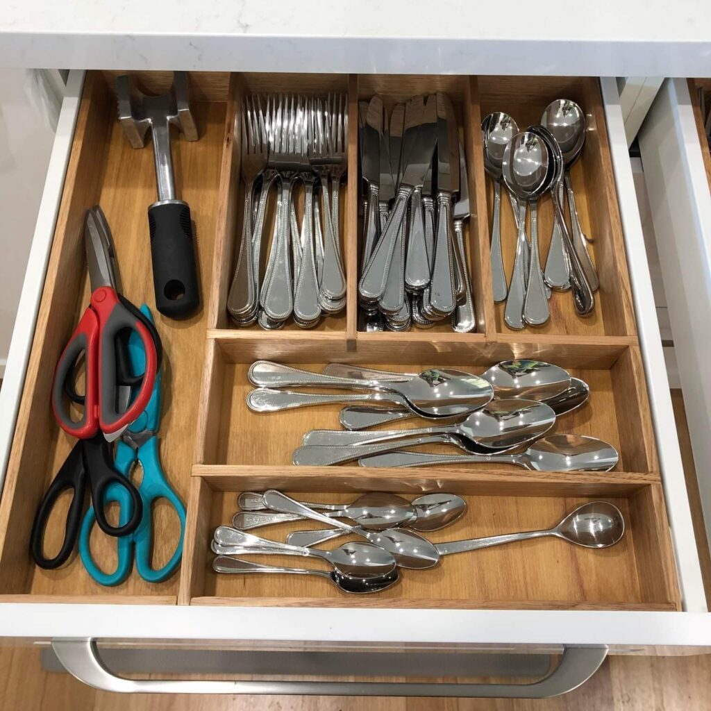 Cutlery divider with items in it (one of two)